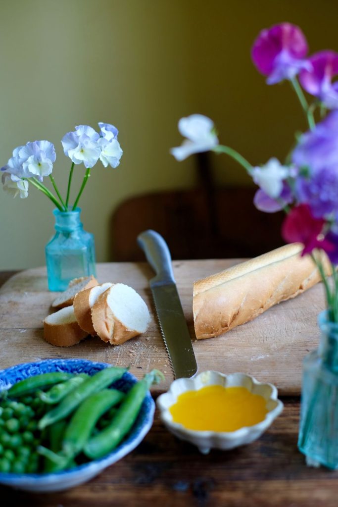 Baguette and bread knife on a cutting board