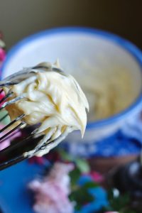 Thick, creamy mayonnaise on a whisk