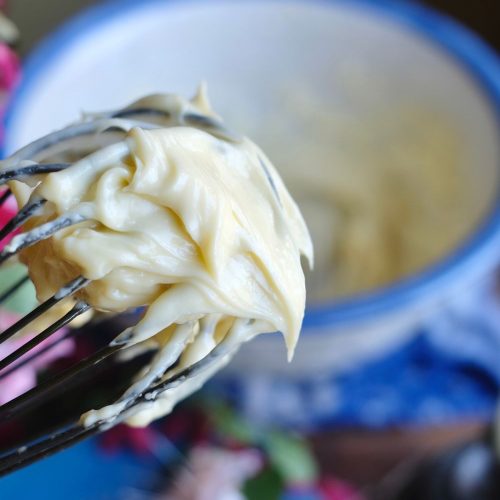 Thick, creamy mayonnaise on a whisk