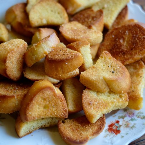 Homemade garlic croutons on a platter